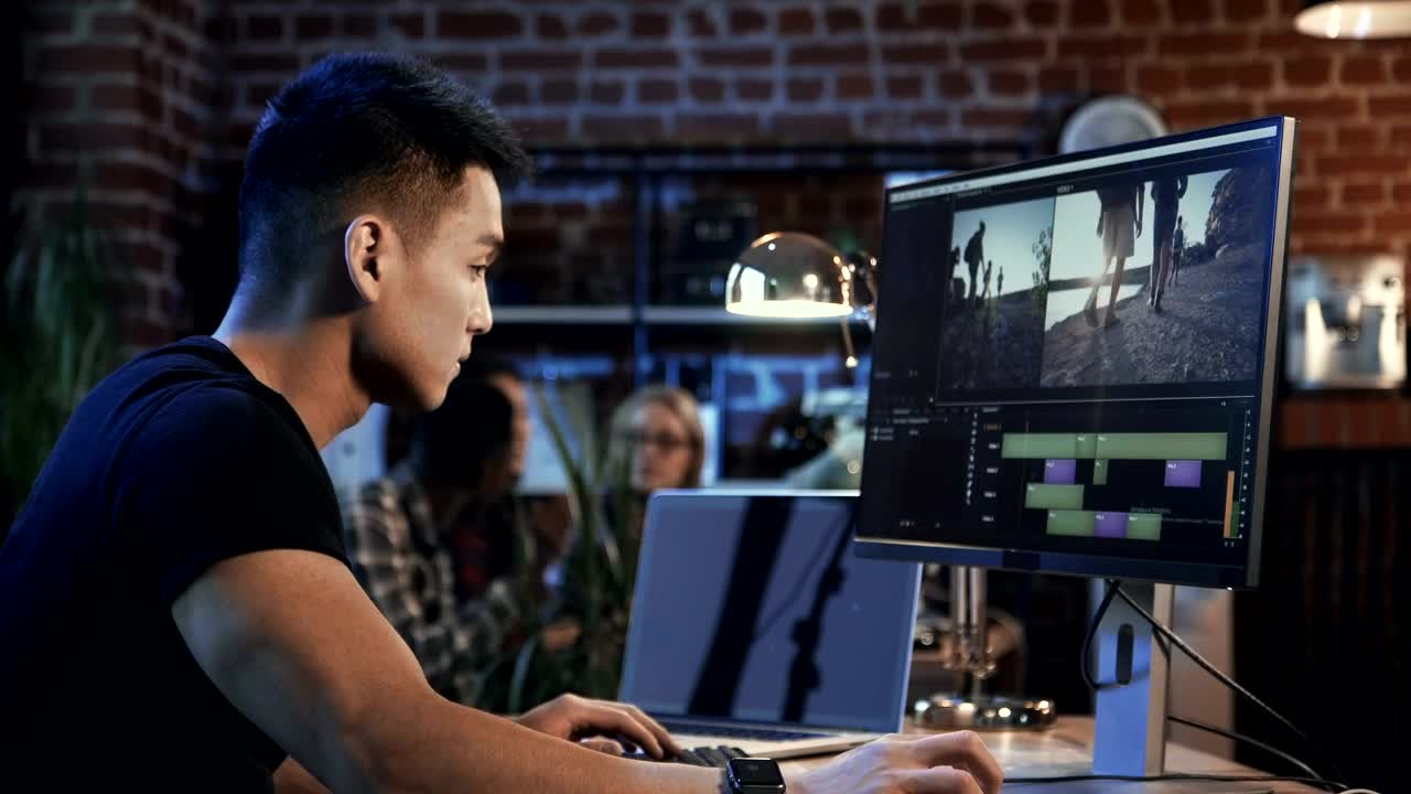 Stock Video Man Editing Video In The Computer Animated Wallpaper