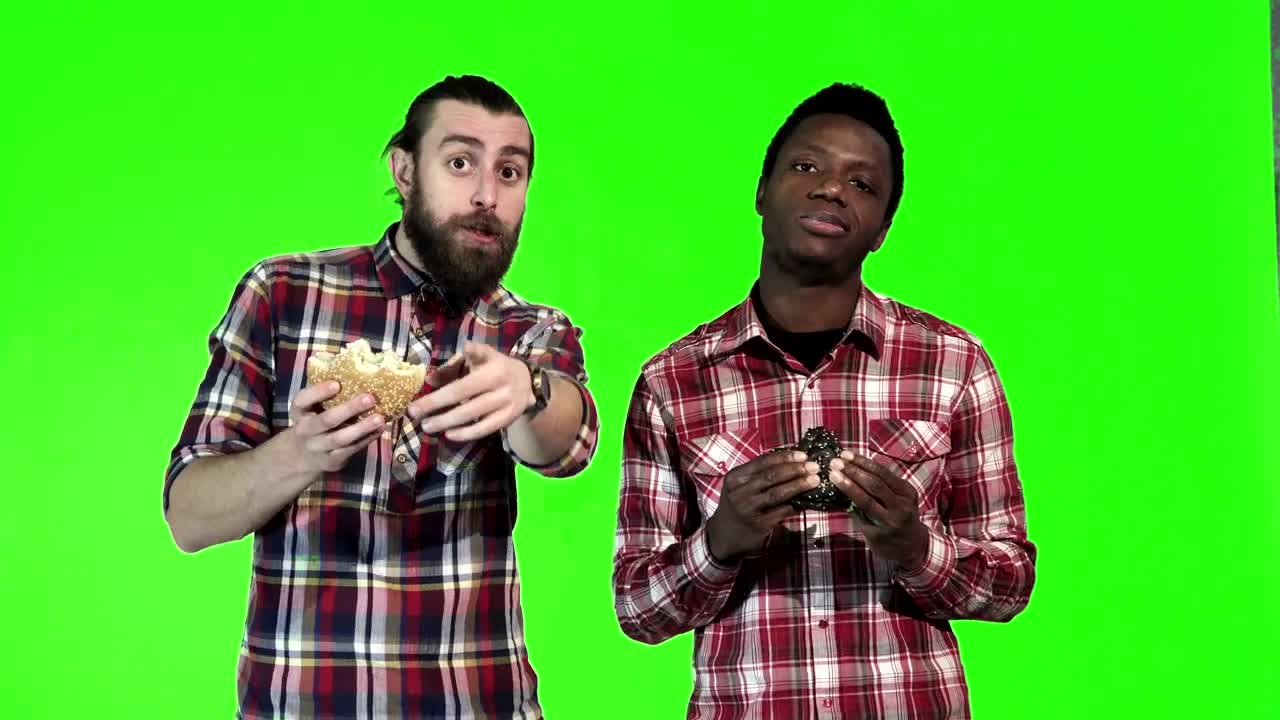 Stock Video Man Eating Burgers And Watching Animated Wallpaper