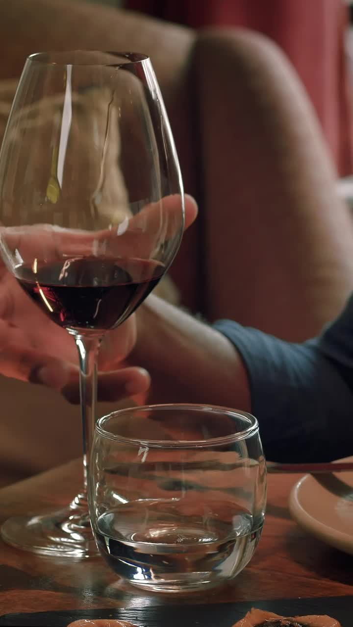 Stock Video Man Drinking Wine From A Glass At A Romantic Dinner Animated Wallpaper