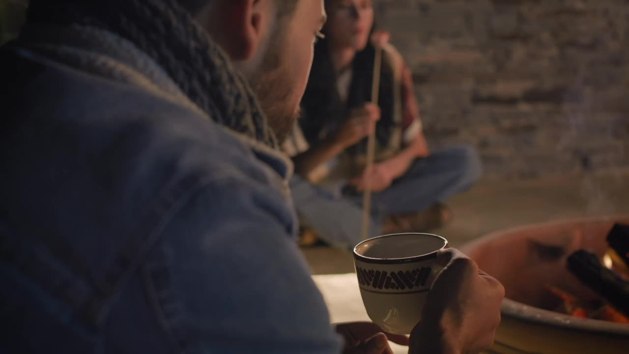 Stock Video Man Drinking Homemade Coffee On A Campfire Night Animated Wallpaper