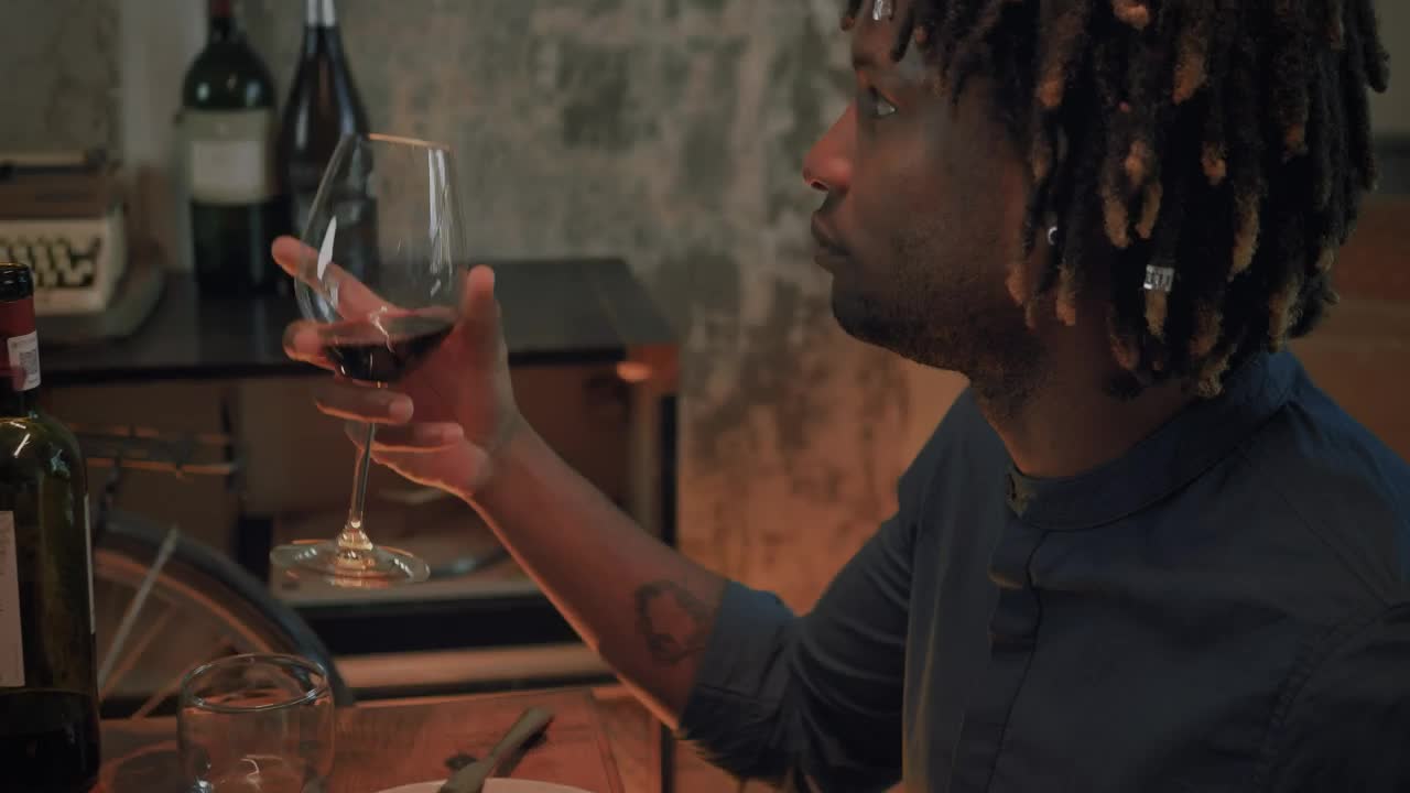 Stock Video Man Drinking From His Glass Of Wine On A Romantic Animated Wallpaper