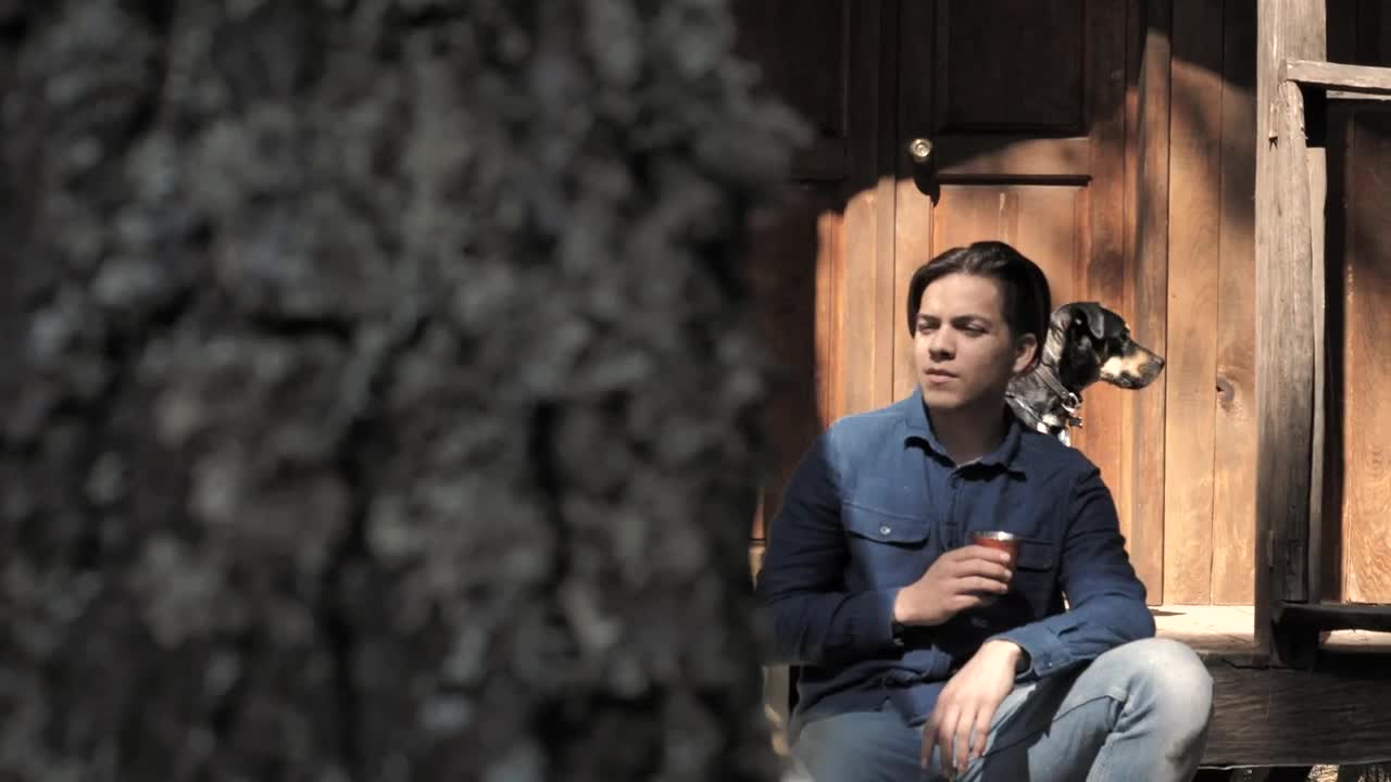 Stock Video Man Drinking Coffee Out His Cabin Animated Wallpaper