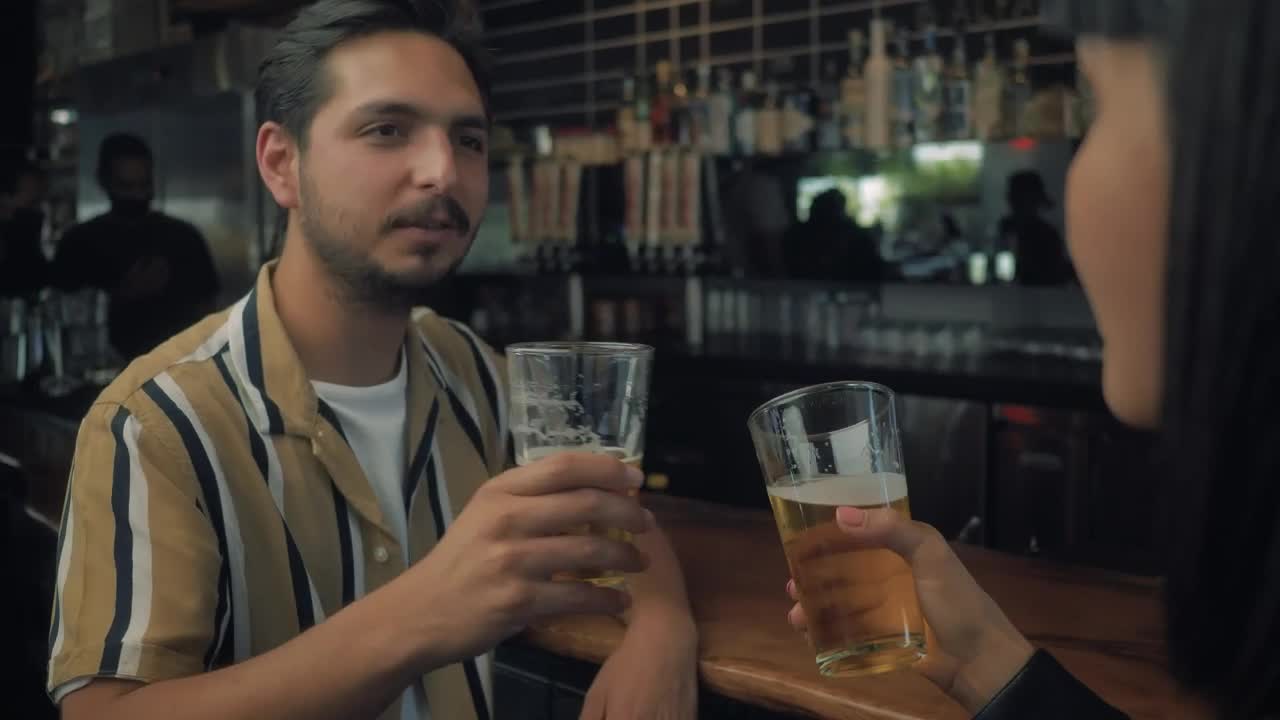 Stock Video Man Drinking Beer With His Date Animated Wallpaper