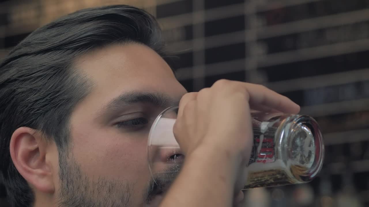 Stock Video Man Drinking Beer From A Glass Animated Wallpaper