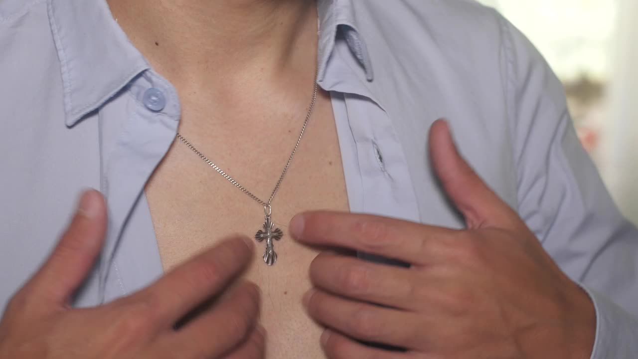 Stock Video Man Doing Up Shirt Buttons Animated Wallpaper