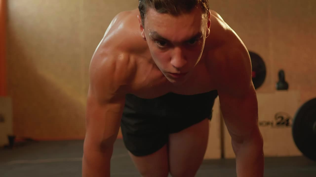 Stock Video Man Doing Strenuous Exercise In A Gym Animated Wallpaper