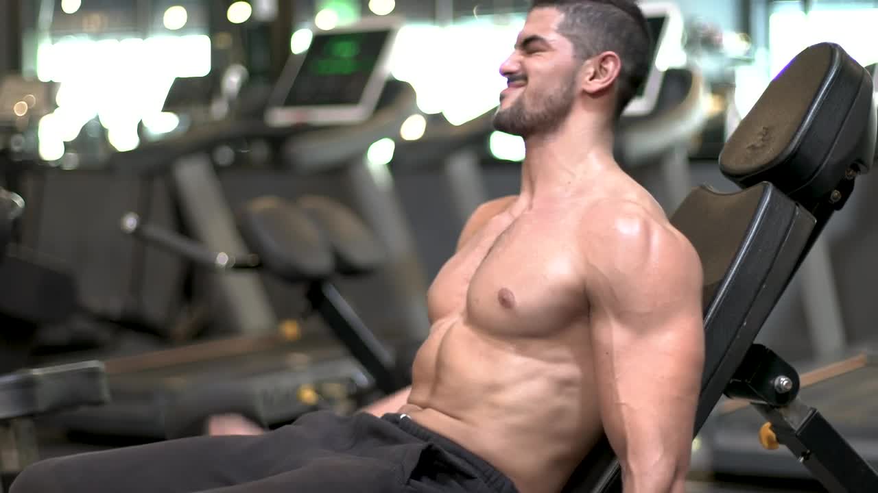 Stock Video Man Doing Reps With A Pair Of Dumbbells Animated Wallpaper