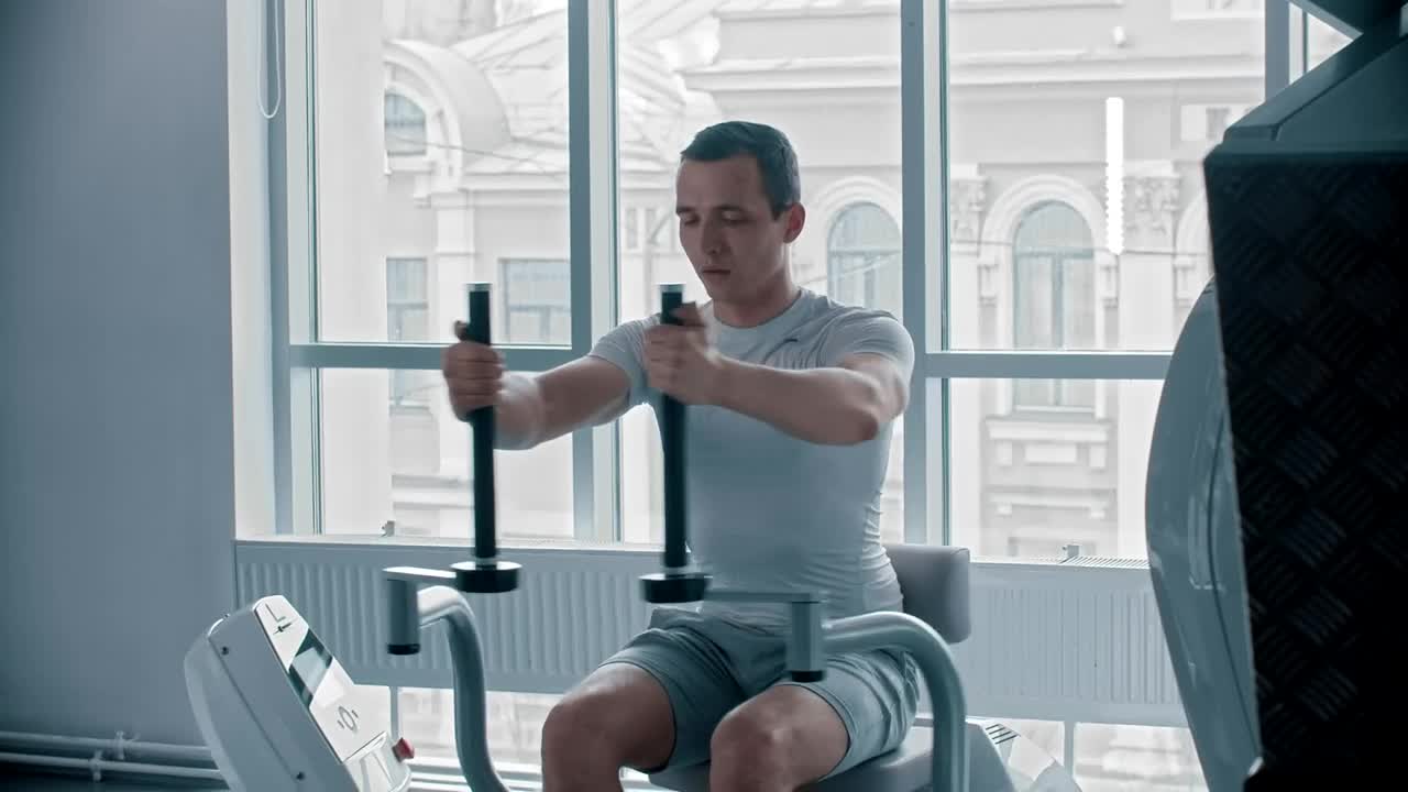 Stock Video Man Doing Chest Exercise At A White Gym Animated Wallpaper