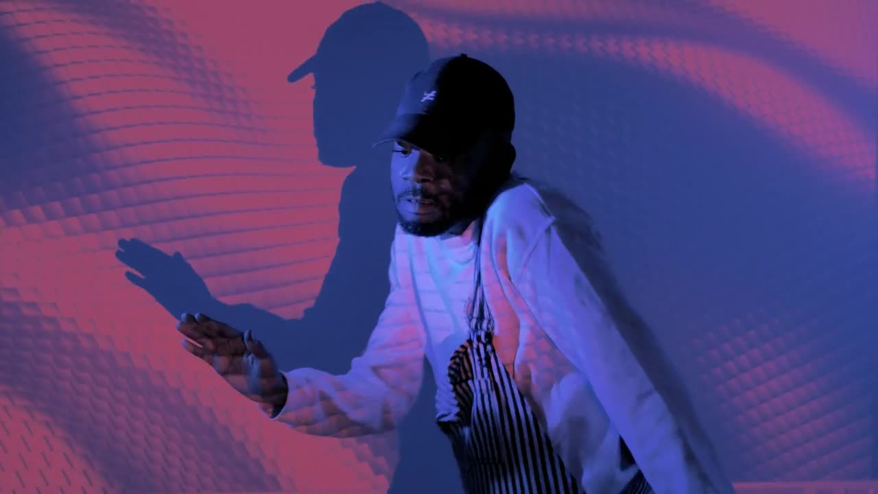 Stock Video Man Dancing With Shapes Projected On Him Animated Wallpaper