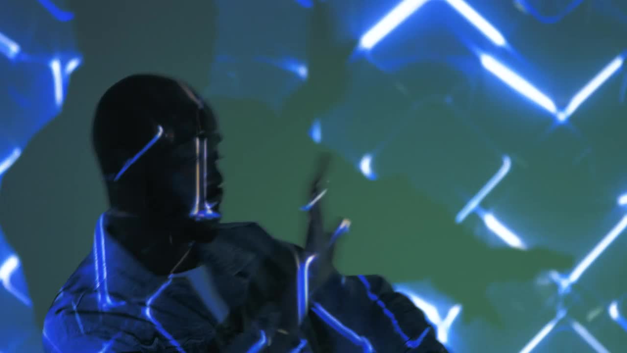 Stock Video Man Dancing With Lights Animated Wallpaper