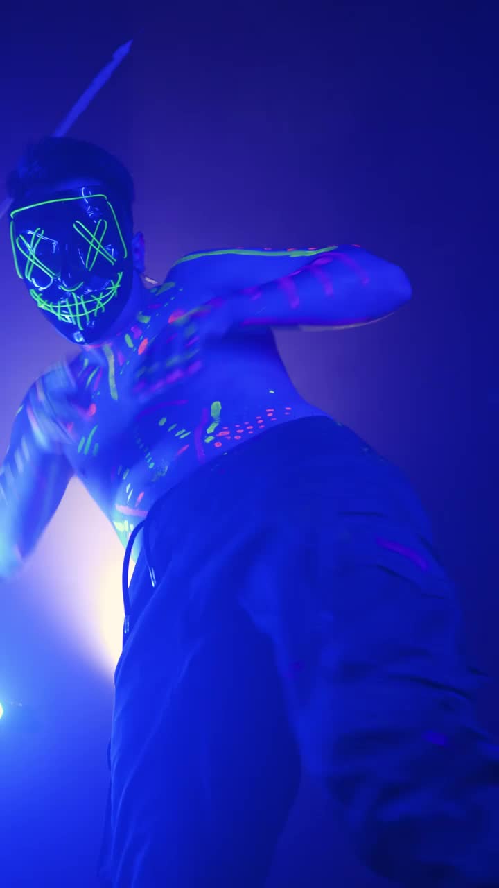 Stock Video Man Dancing With Fluorescent Paint And A Mask Animated Wallpaper