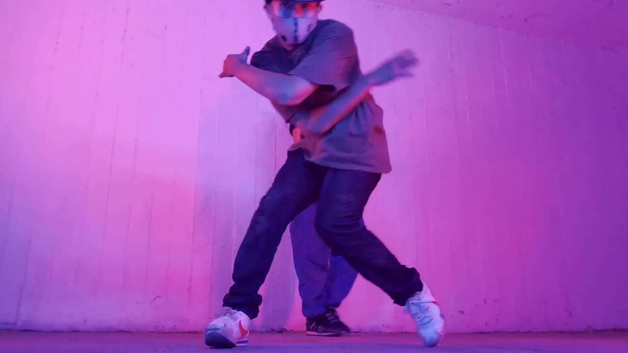 Stock Video Man Dancing Break Dance With A Girl Behind Animated Wallpaper