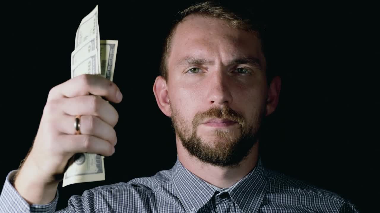 Stock Video Man Crumples Dollar Bills And Throws Them Away Animated Wallpaper