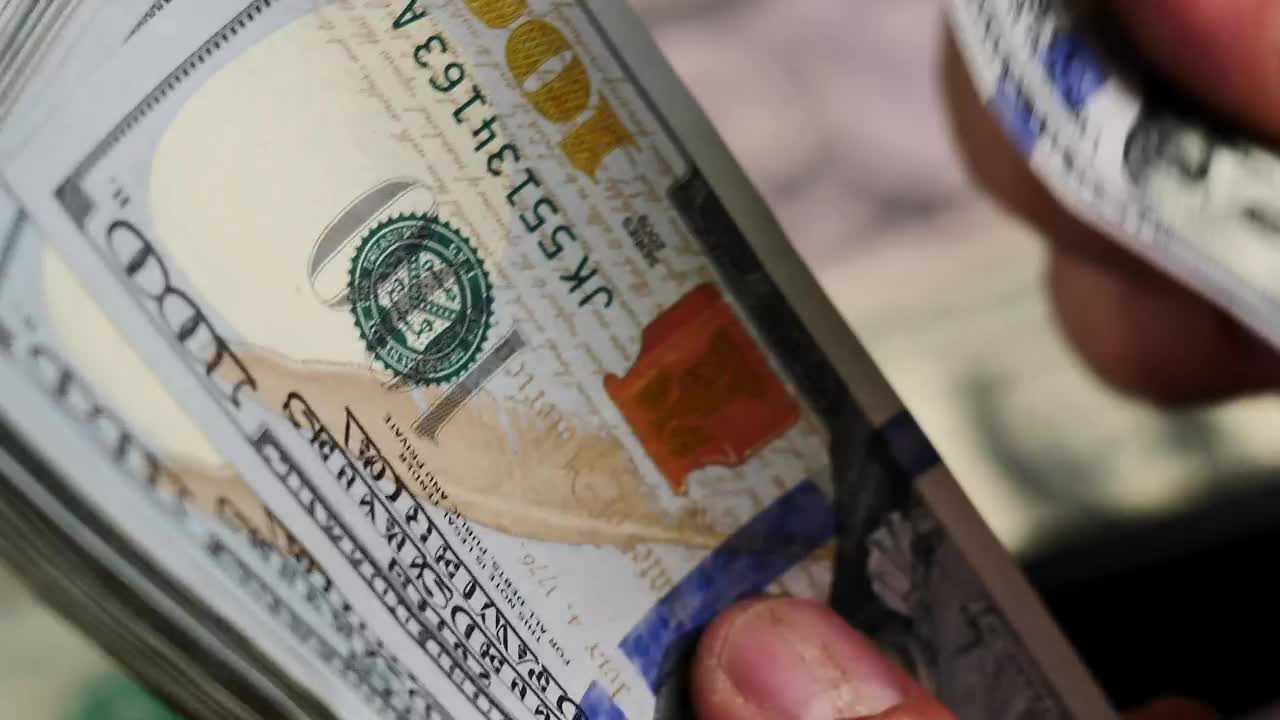 Stock Video Man Counting A Wad Of Bills Seen Very Closely Animated Wallpaper