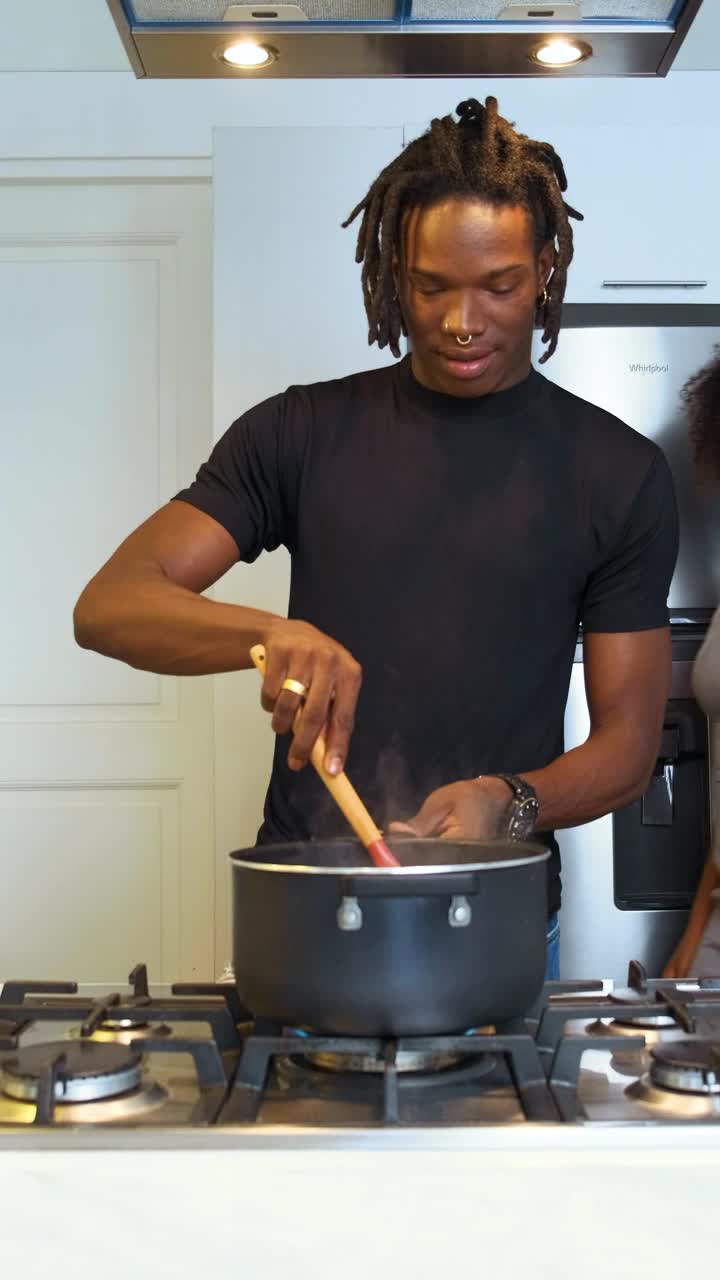 Stock Video Man Cooking Is Surprised By His Wife With A Hug Animated Wallpaper