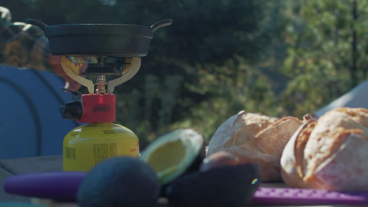 Stock Video Man Cooking At The Campsite Animated Wallpaper