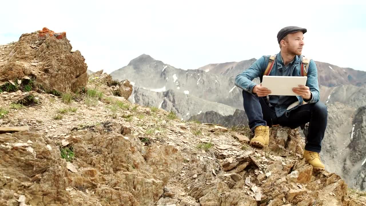 Stock Video Man Connected To A Network On A Mountain Animated Wallpaper