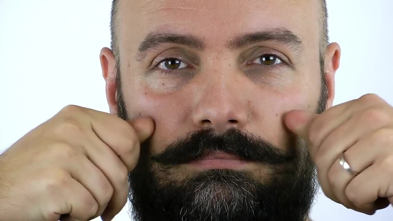 Stock Video Man Combing His Mustache Animated Wallpaper