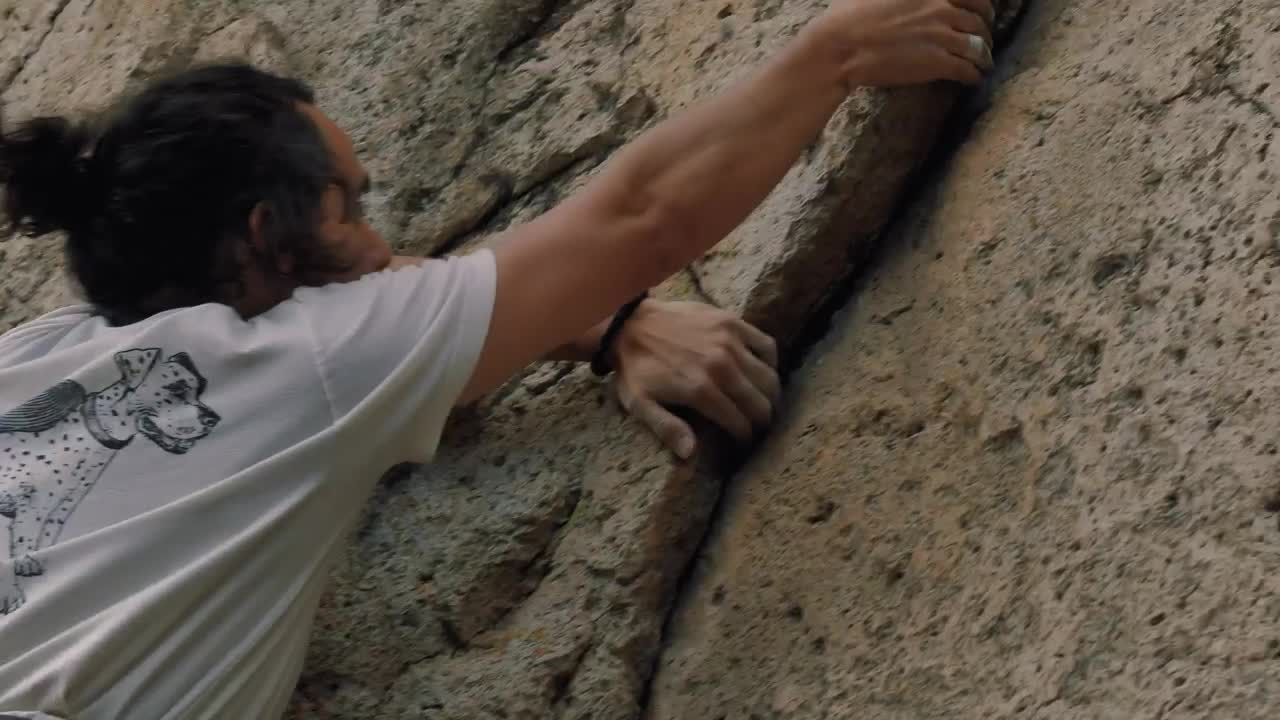 Stock Video Man Climbing A Rocky Mountain Animated Wallpaper