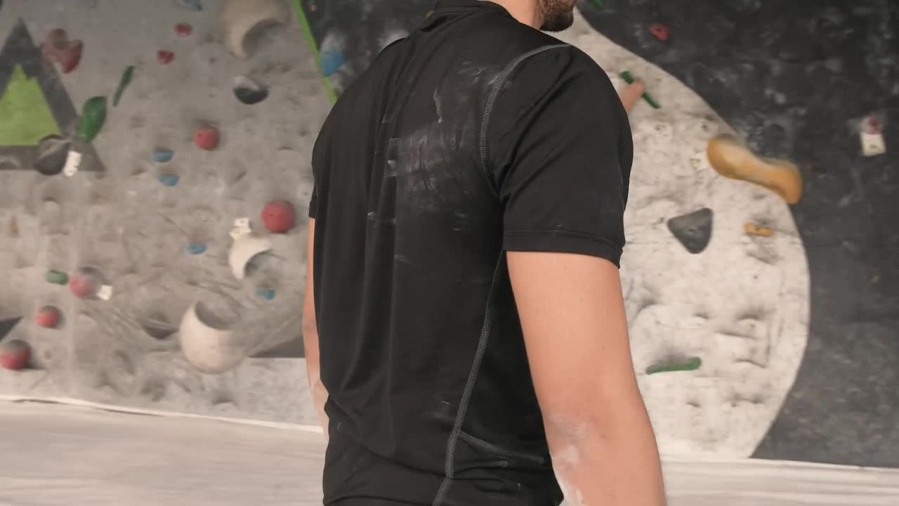 Stock Video Man Climbing A Mountaineering Training Wall Animated Wallpaper