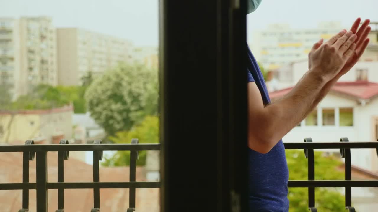 Stock Video Man Clapping While Wearing A Mask Animated Wallpaper