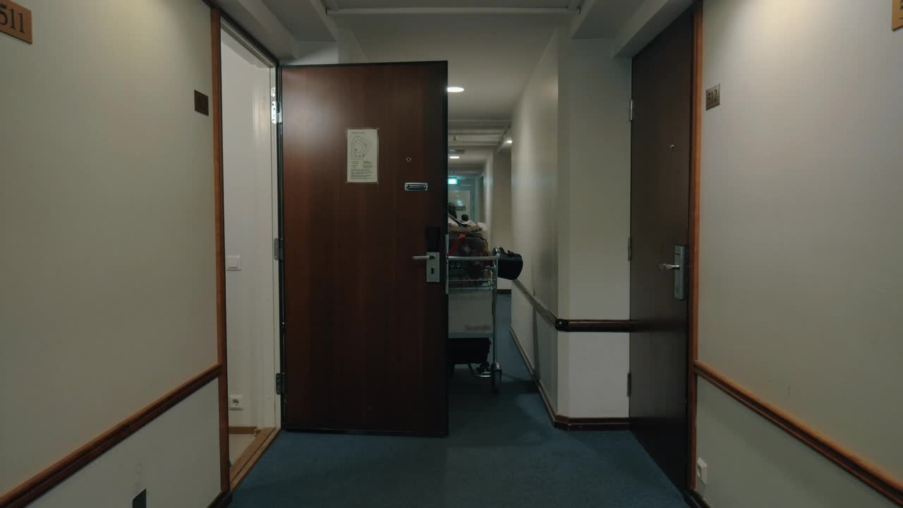 Stock Video Man Checking Out Of A Hotel Room Animated Wallpaper