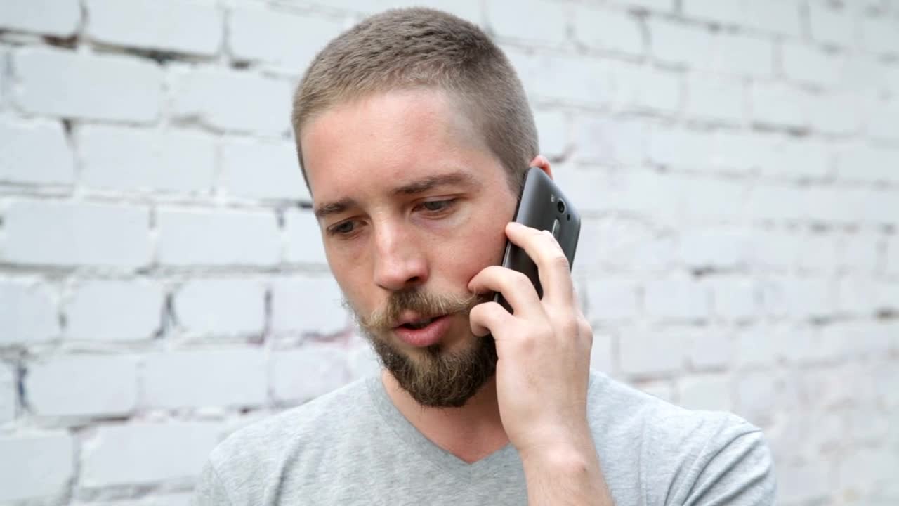 Stock Video Man Chatting On His Phone Animated Wallpaper