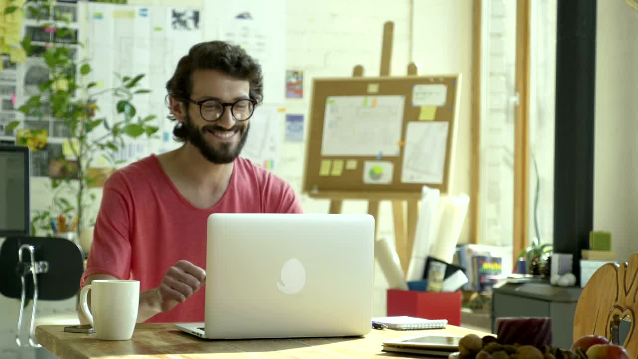 Stock Video Man Celebrating In Front Of The Computer Animated Wallpaper
