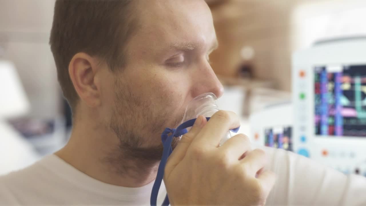 Stock Video Man Breathing And Coughing On The Hospital Animated Wallpaper