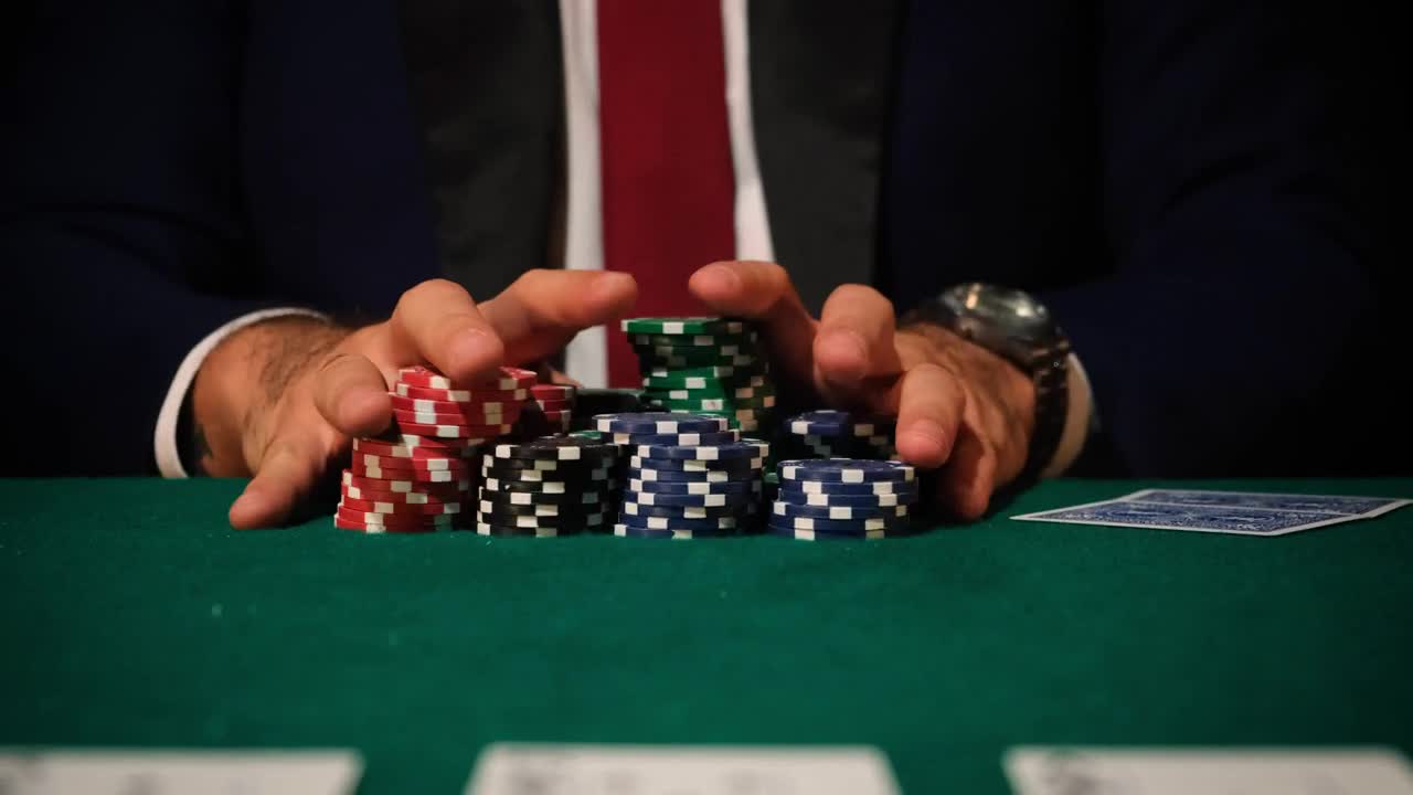 Stock Video Man Betting All His Chips In A Poker Game Animated Wallpaper