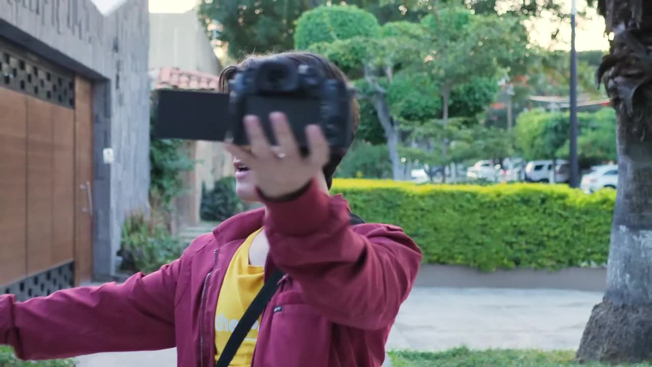 Stock Video Man Being Recorded Himself For A Blog On The Street Animated Wallpaper
