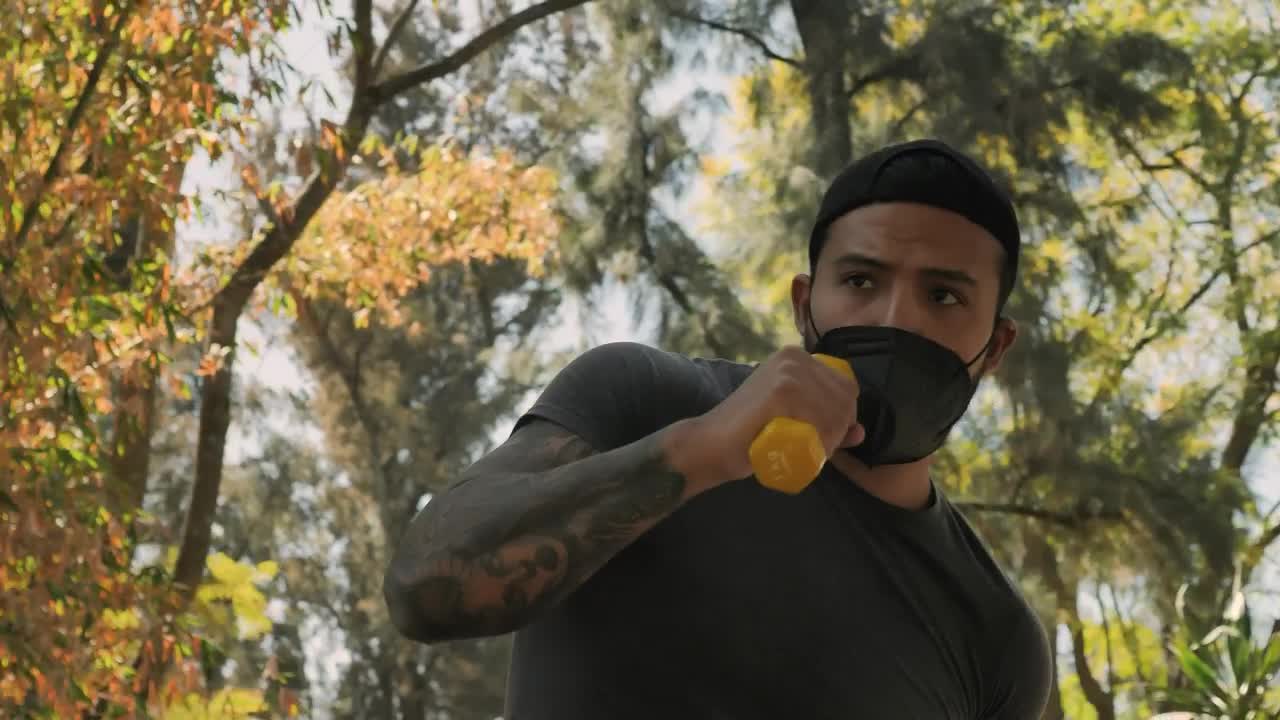 Stock Video Man At Boxing Training With Dumbbells Animated Wallpaper