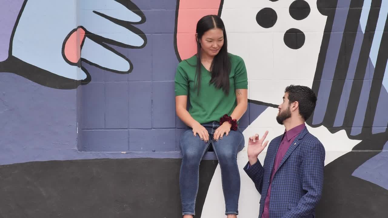 Stock Video Man Arrives With His Friends Greeting Each Other With Their Animated Wallpaper