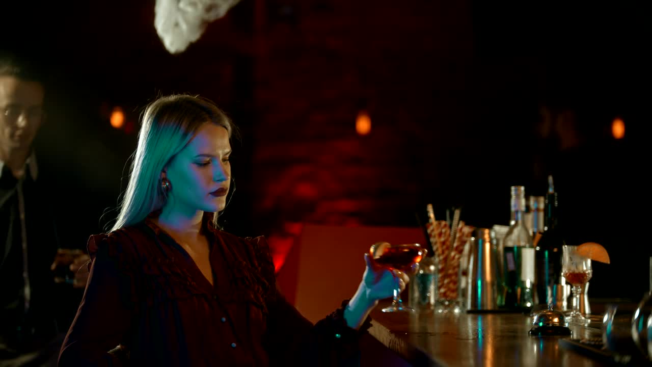 Stock Video Man Approaches To Chat With A Woman In A Bar Animated Wallpaper