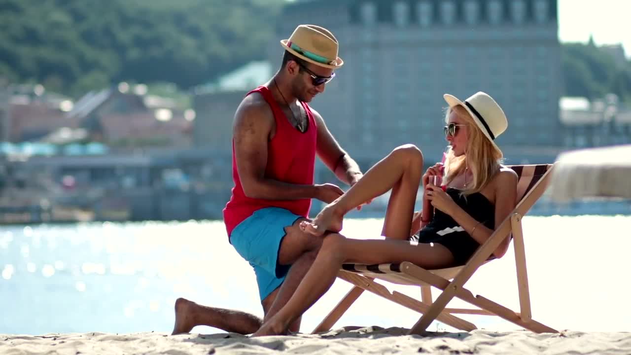 Stock Video Man Applying Sunscreen Animated Wallpaper