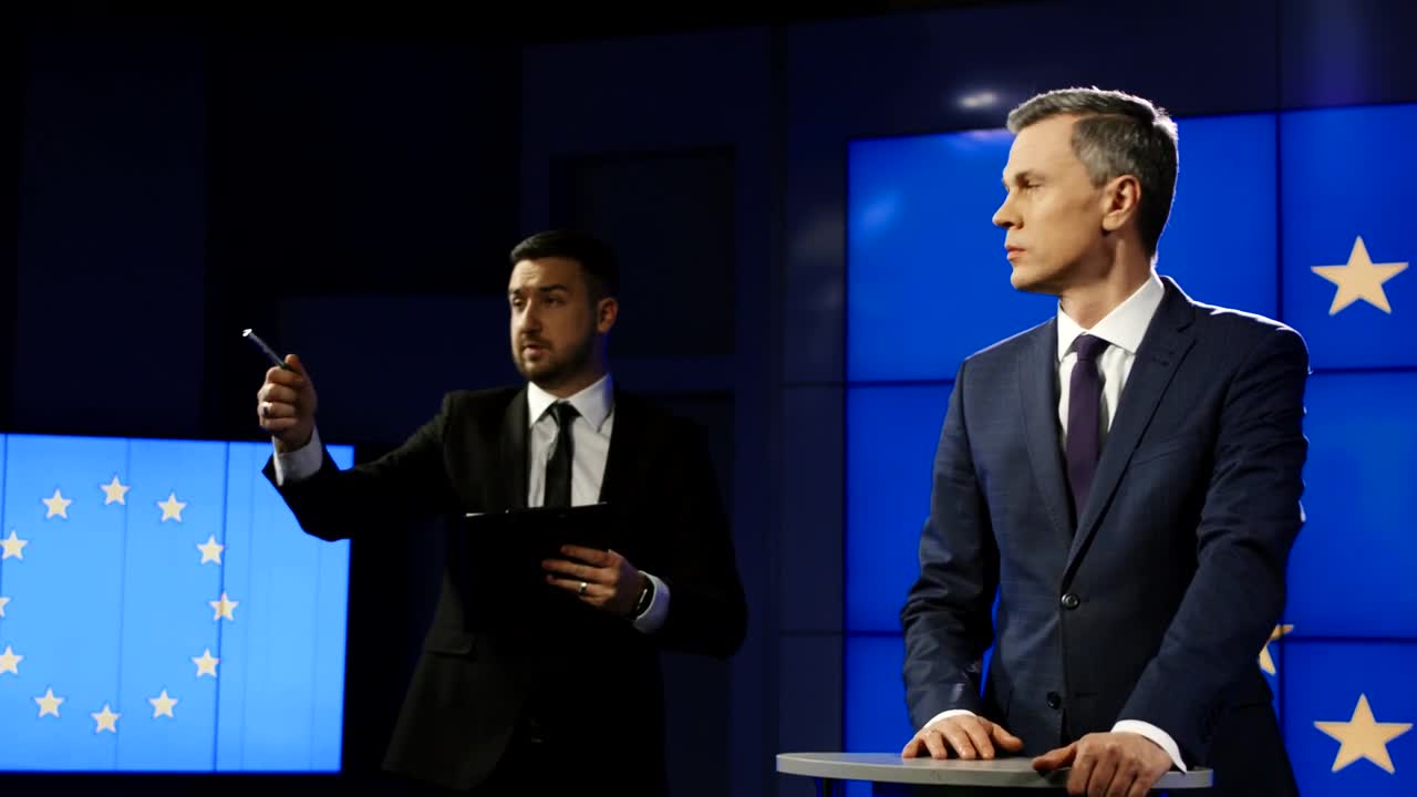 Stock Video Man Answering Questions In A Press Conference Animated Wallpaper