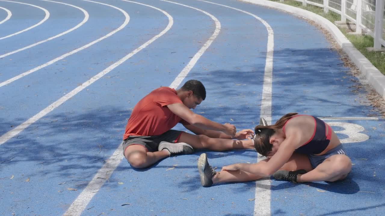 Stock Video Man And Woman Stretching Their Body Before Doing Sports Animated Wallpaper