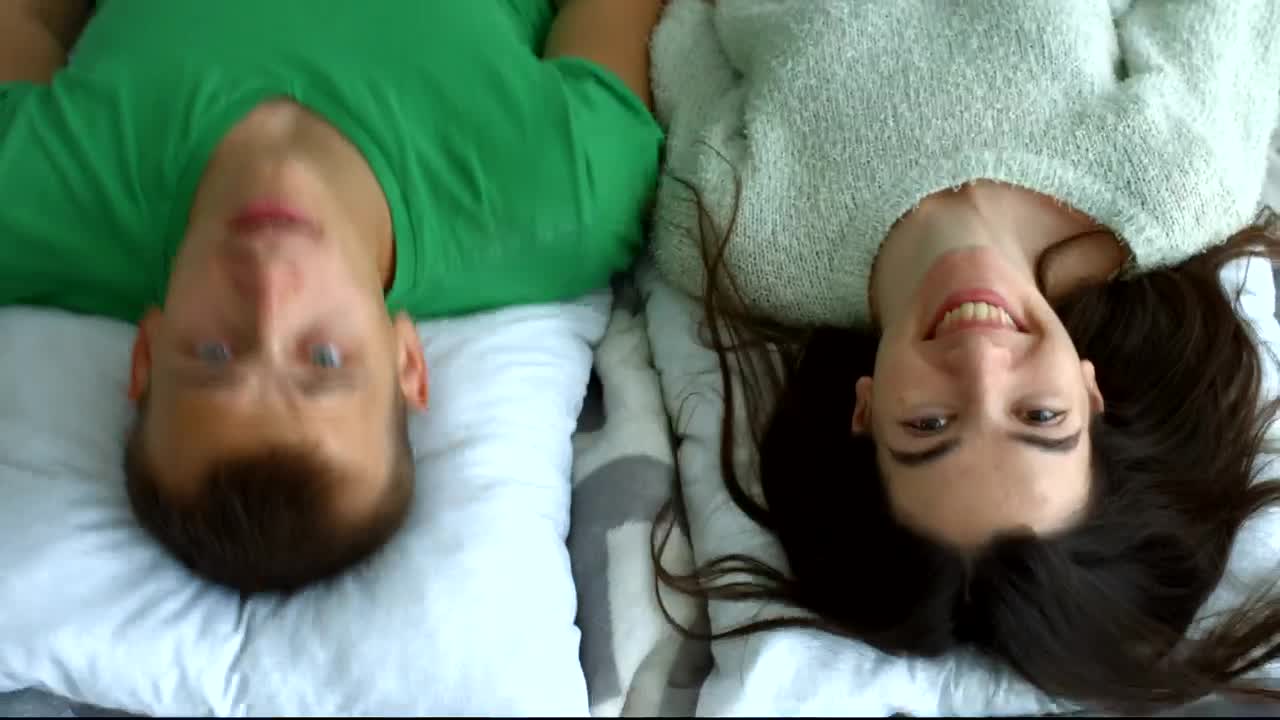 Stock Video Man And Woman Lying On A Bed Animated Wallpaper