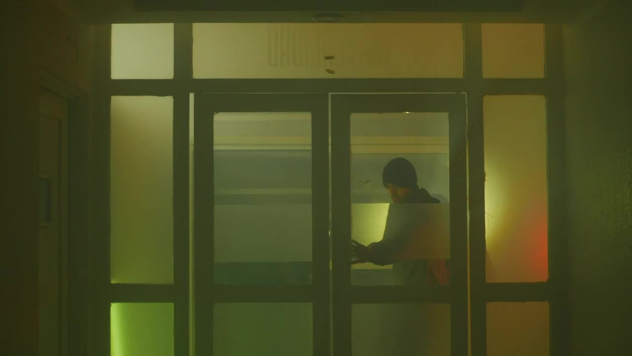 Stock Video Man And Woman Exploring An Empty Building At Night Animated Wallpaper