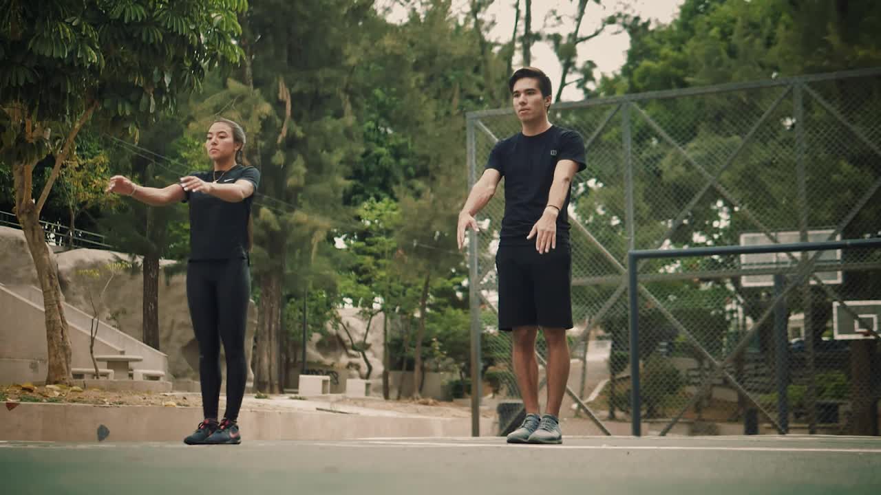 Stock Video Man And Woman Doing A Back Turn In Unison Animated Wallpaper