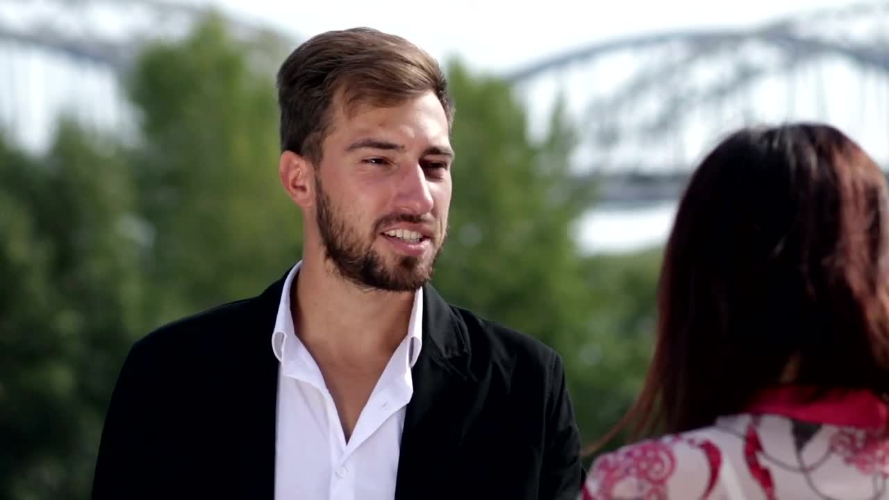 Stock Video Man And Woman Chatting In The Street Animated Wallpaper