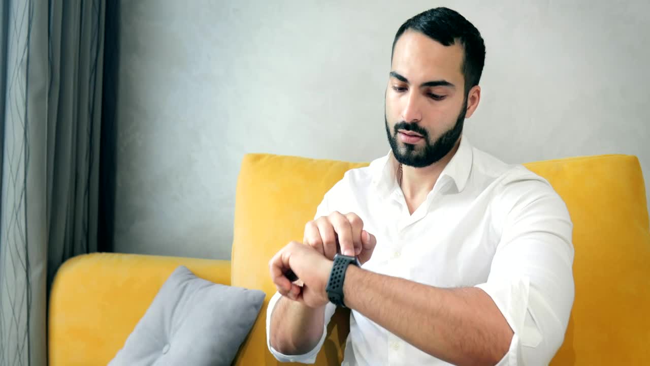 Stock Video Man Activates Futuristic Hologram Browser With Smart Watch Animated Wallpaper