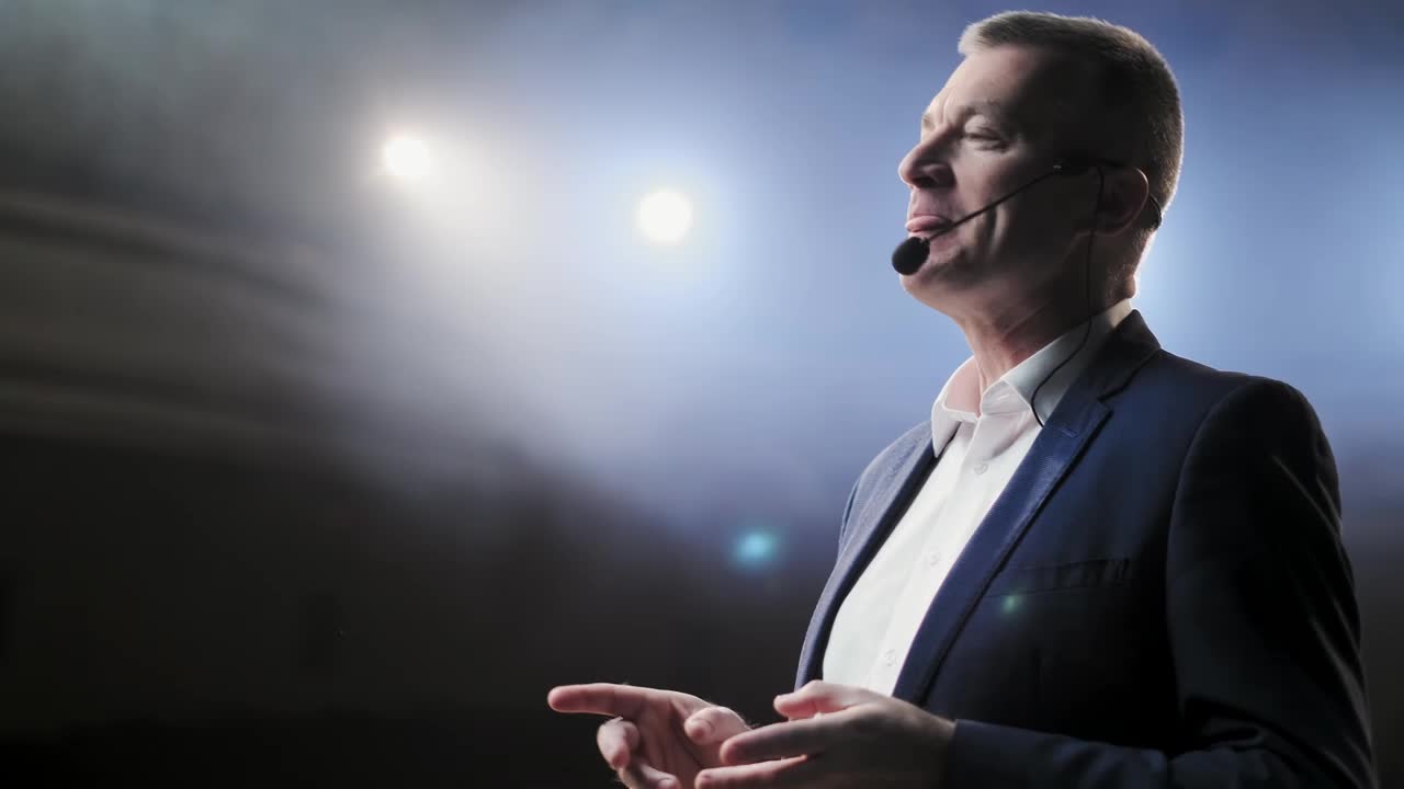 Stock Video Male Speaker Giving A Talk At A Forum Animated Wallpaper