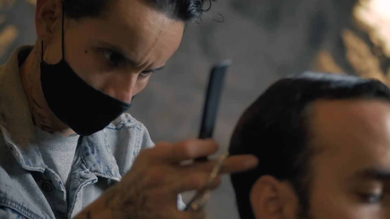 Stock Video Male Hairstylist Cutting A Clients Hair Animated Wallpaper