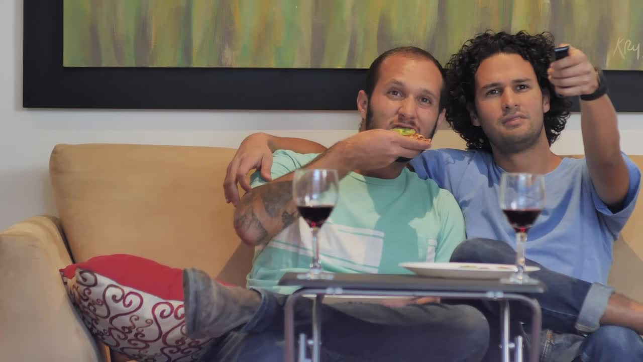 Stock Video Male Couple Watching Television Animated Wallpaper