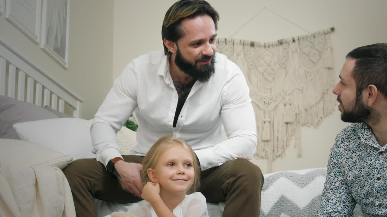 Stock Video Male Couple And Daughter At Home Animated Wallpaper