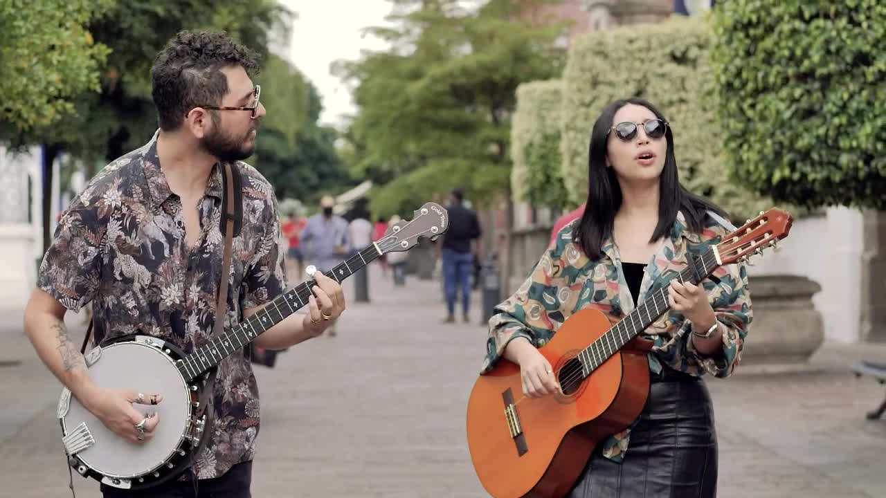 Stock Video Male And Female Friends Walking Through A Park While Playing Animated Wallpaper