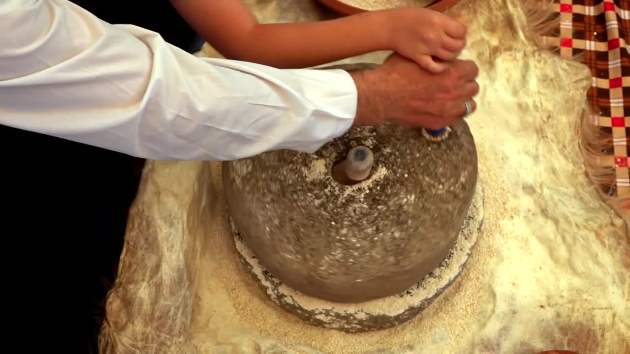 Stock Video Making Wheat Flour In A Rotating Stone Animated Wallpaper