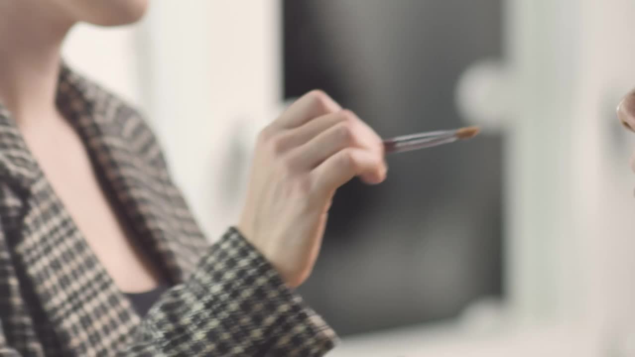 Stock Video Making Up A Young Female Model Animated Wallpaper