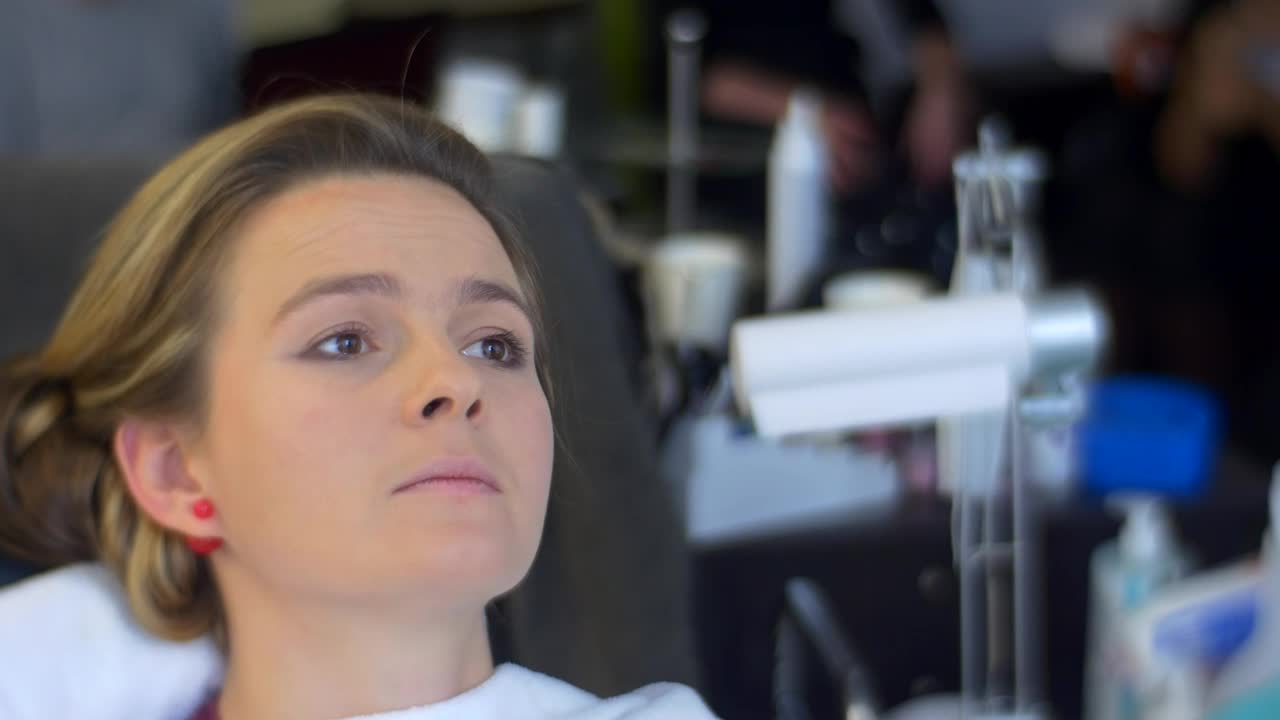 Stock Video Making Up A Womans Face In A Salon Animated Wallpaper